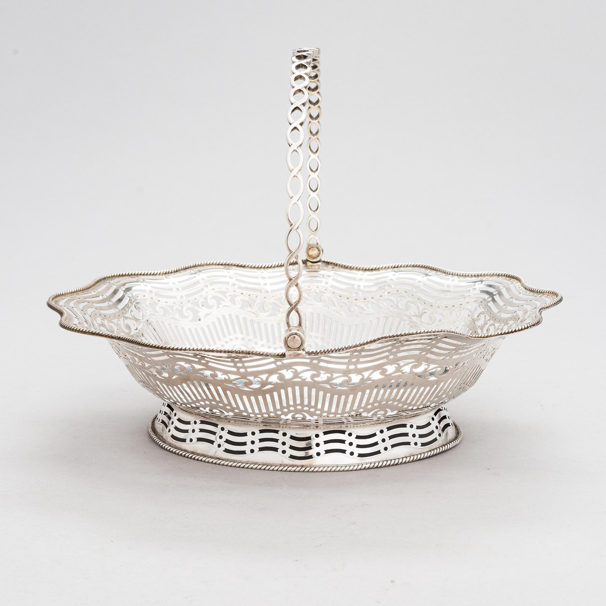 A George III sterling silver breadbasket, maker's mark of William Plummer, London 1777.