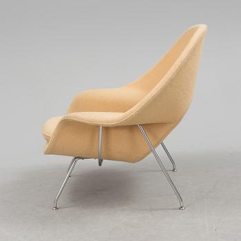 EERO SAARINEN, a "Womb chair" by knoll international.