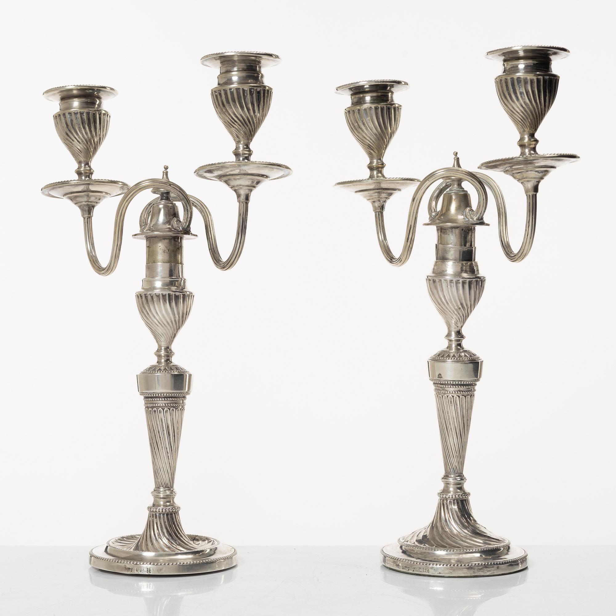 A pair of English silver candelabra, mark of Hawksworth, Eyre & Co Ltd, Sheffield 1892.