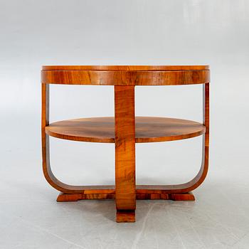 An Art Deco style walnut coffee table later part of the 20th century.