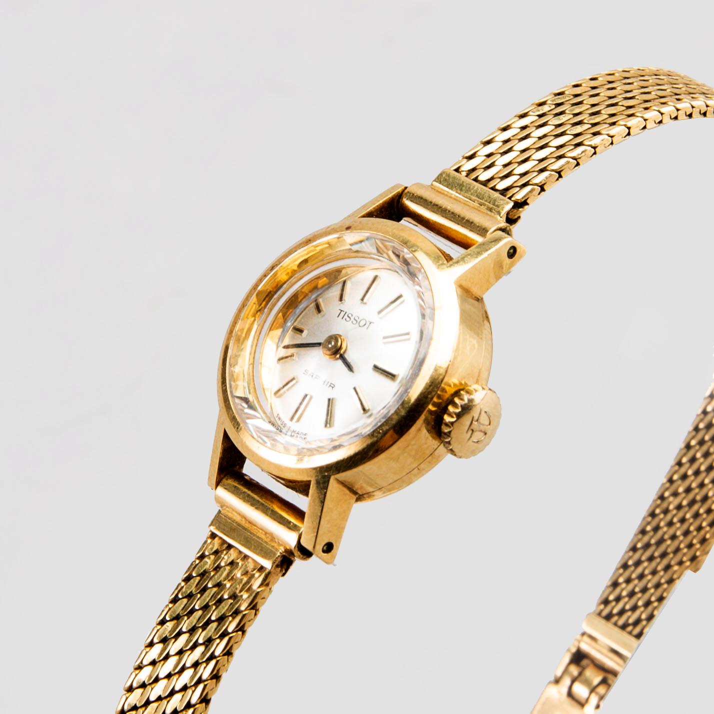 A Tissot Saphir ladies 18 Carat gold wrist watch 11 mm total weight ca 25 gr. Bukowskis