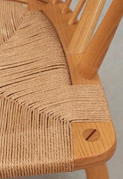 A Hans J Wegner ash and teak 'Peacock chair', Johannes Hansen, Denmark.