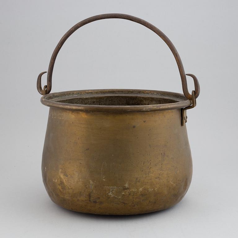 A large 18th century brass cauldron.