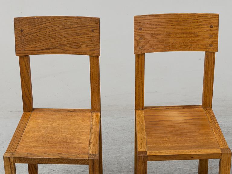 MARIO PRANDINA, an oak table and four chairs, Plinio Il Giovane, Italy.