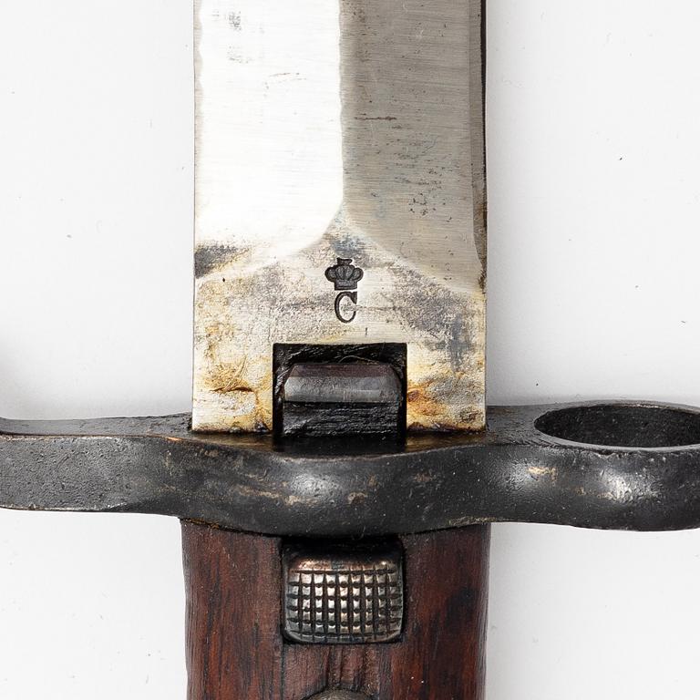 Three Swedish bayonets with scabbards.