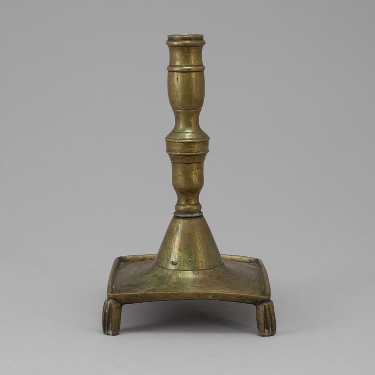 A 17th century bronze candlestick.