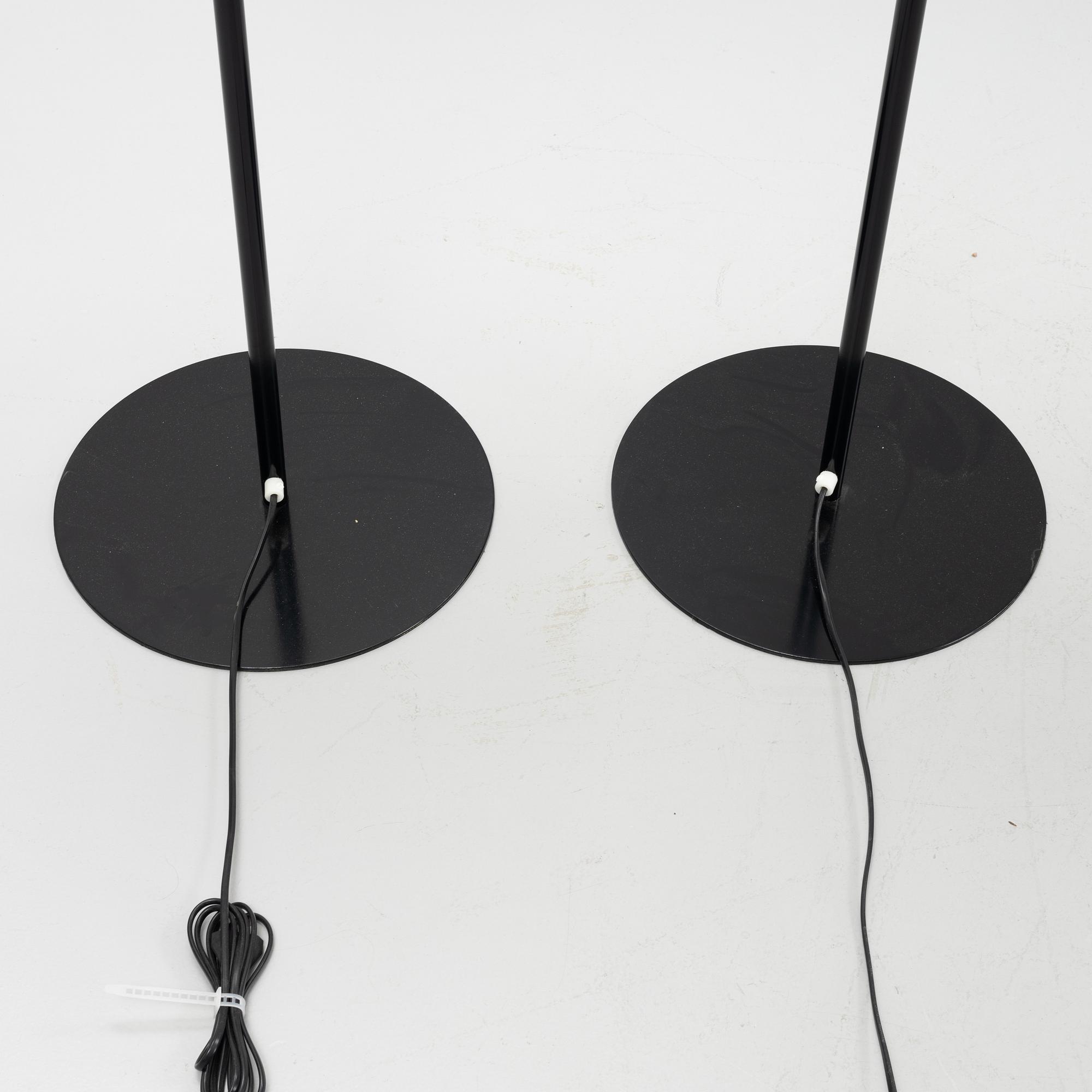 A pair of black metal floorlights, Luxus, Vittsjö.