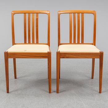 A 1950/60s teak and valnut table and four chairs.