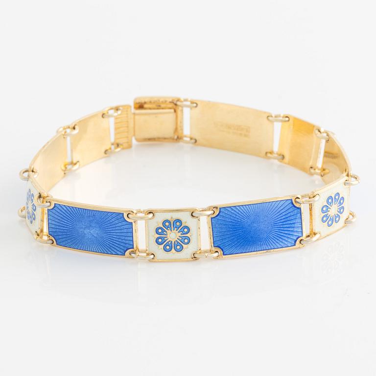 David Andersen, bracelet and two brooches, gilded silver and enamel, Norway.