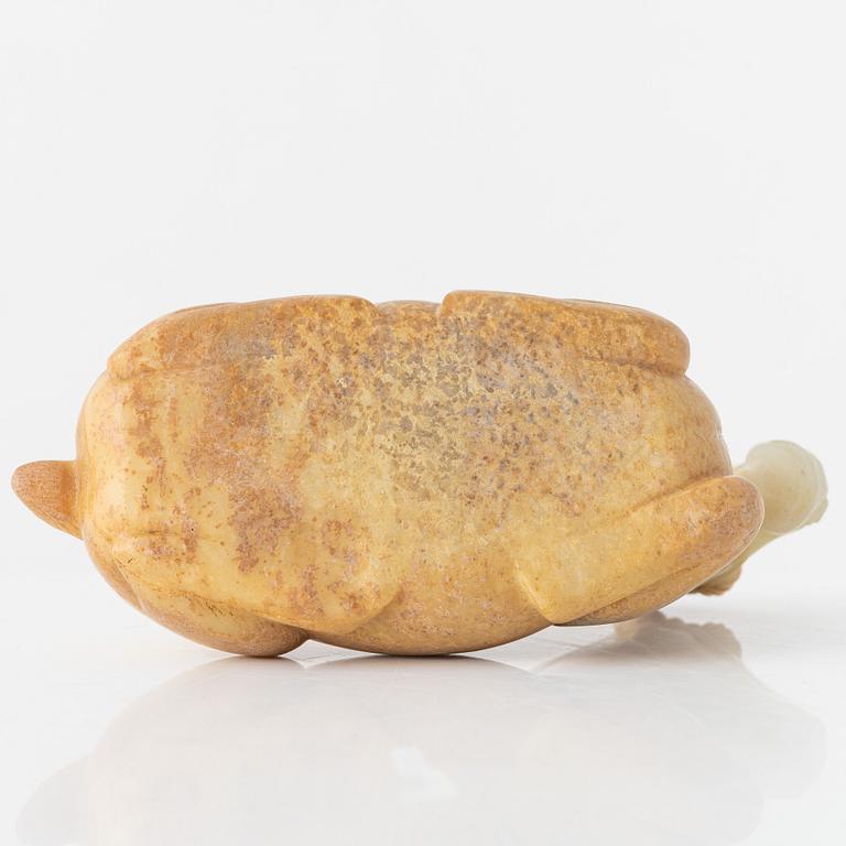 A carved nephrite figure of a reclining horse, 20th Century.