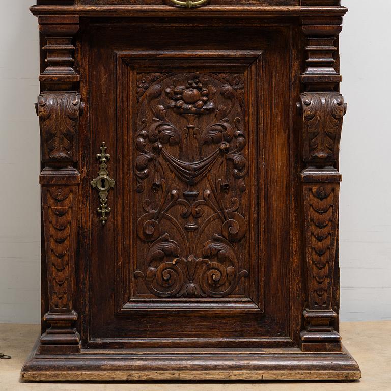 A long-case clock, late 19th century.