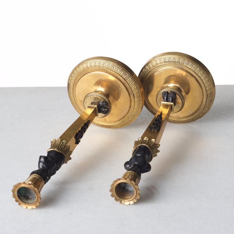 A pair of Empire style candlesticks. Late 19th century.