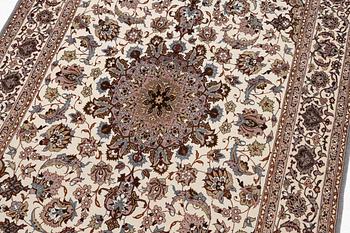 A semi-antique Isfahan rug, central Persia, signed Ghaffarian, c. 180 x 112 cm.