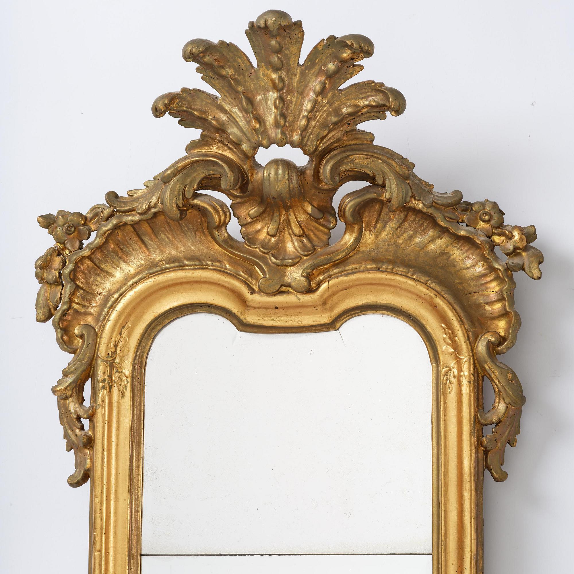 A Swedish rococo giltwood four-branch girandole mirror, Stockholm, later part 18th century.