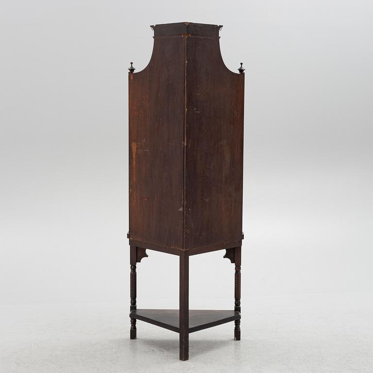 A corner cabinet, Liberty & Co, England, circa 1900.