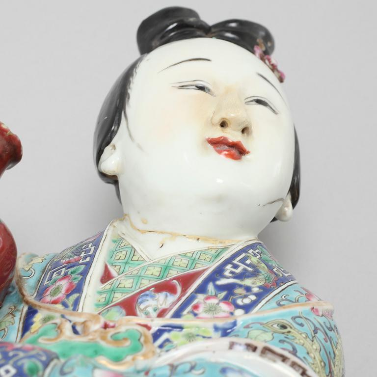 A porcelain figurine from China, late 19th or early 20th century.