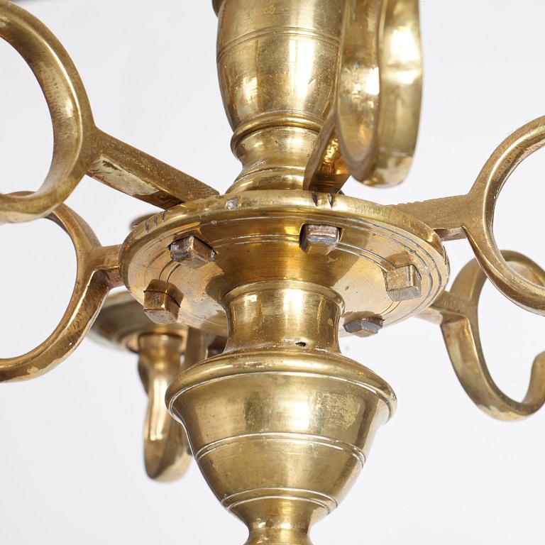 A six-light 18/19th century brass chandelier.