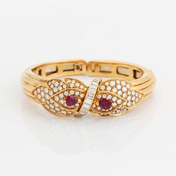 A necklace and a braclet in 18K gold set with faceted rubies.