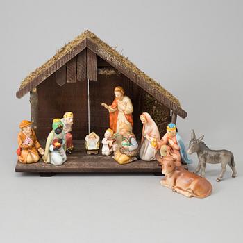 A set of 13 porcelain and wood christmas manger.