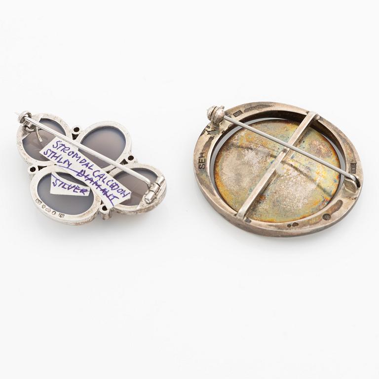 Two brooches, silver with chalcedony and white stones, SE Högberg, Gothenburg 1964 and H Strömdahl, Stockholm.