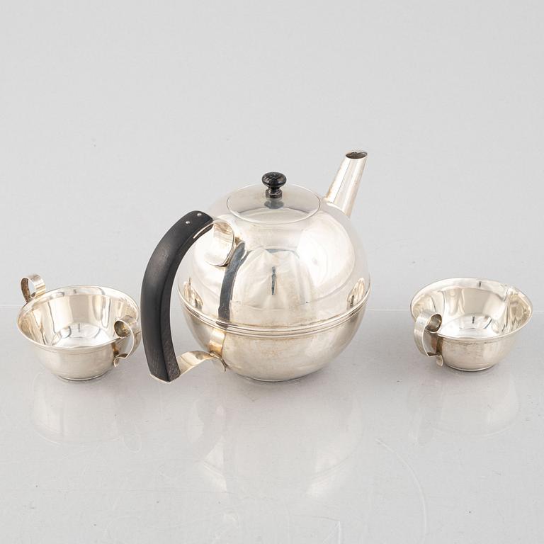 A Swedish Art Déco Silver Coffee Pot, Creamer and Sugar Bowl, mark of CG Hallberg, Stockholm 1936.