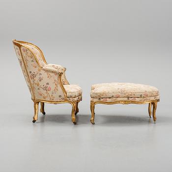 A Louis XV-style bergère armchair with stool, second half of the 19th century.