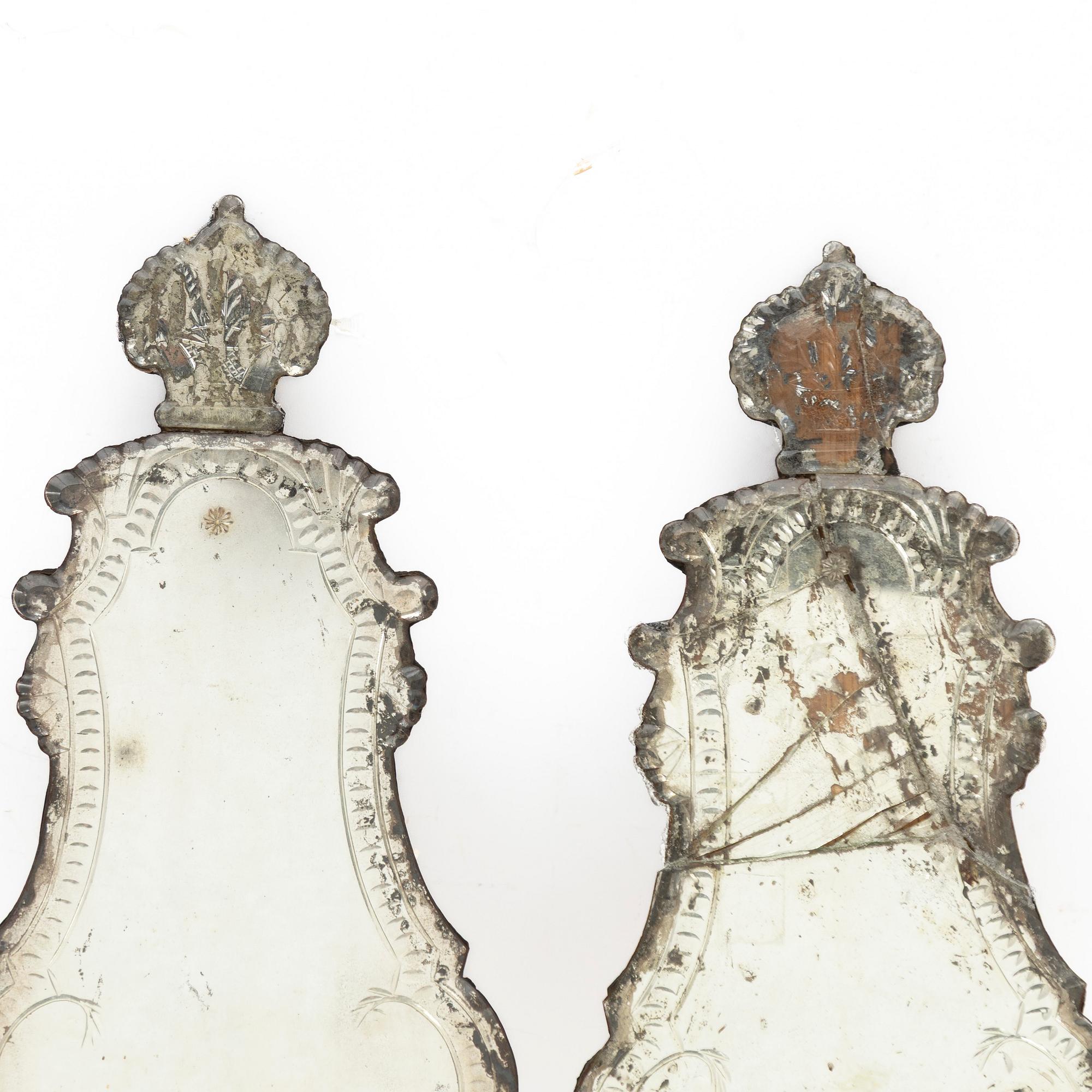 A pair of Nort European late baroque one-light girandole mirrors, mid 18th century.