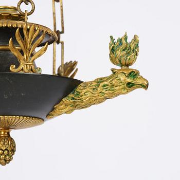 An Empire ormolu and patinated bronze four-light chandelier, Stockholm, early 19th century.