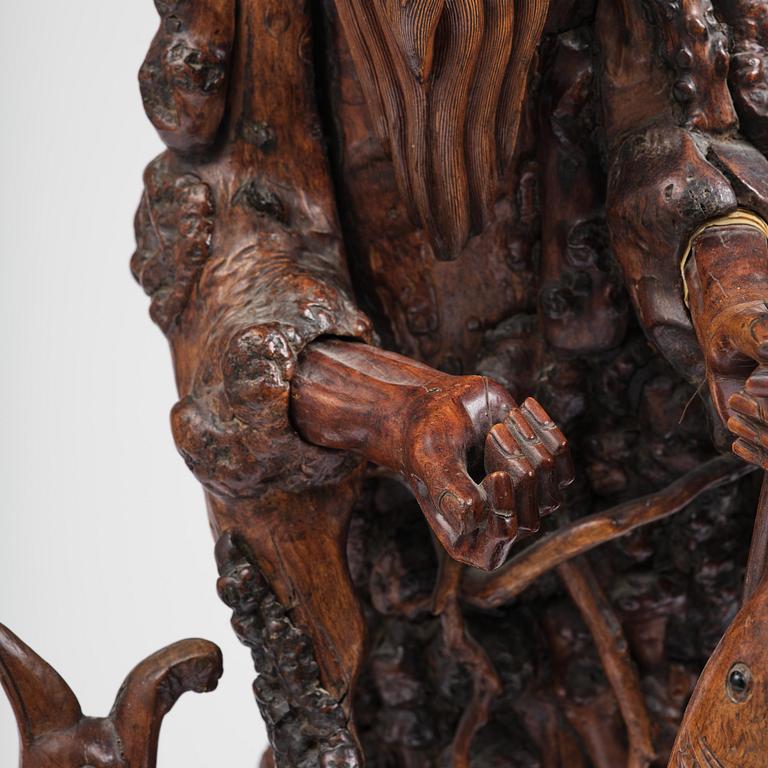 A large well sculptured root sculpture of 'Sholau and attendant', late Qing dynasty, 19th century.