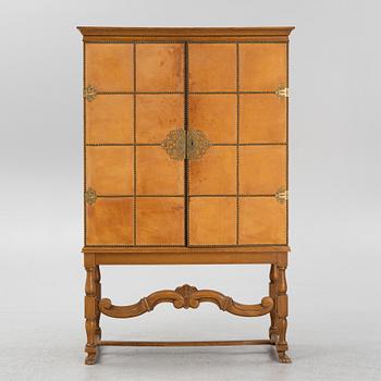 A leather, oak and mahogany cabinet, mid 20th Century.