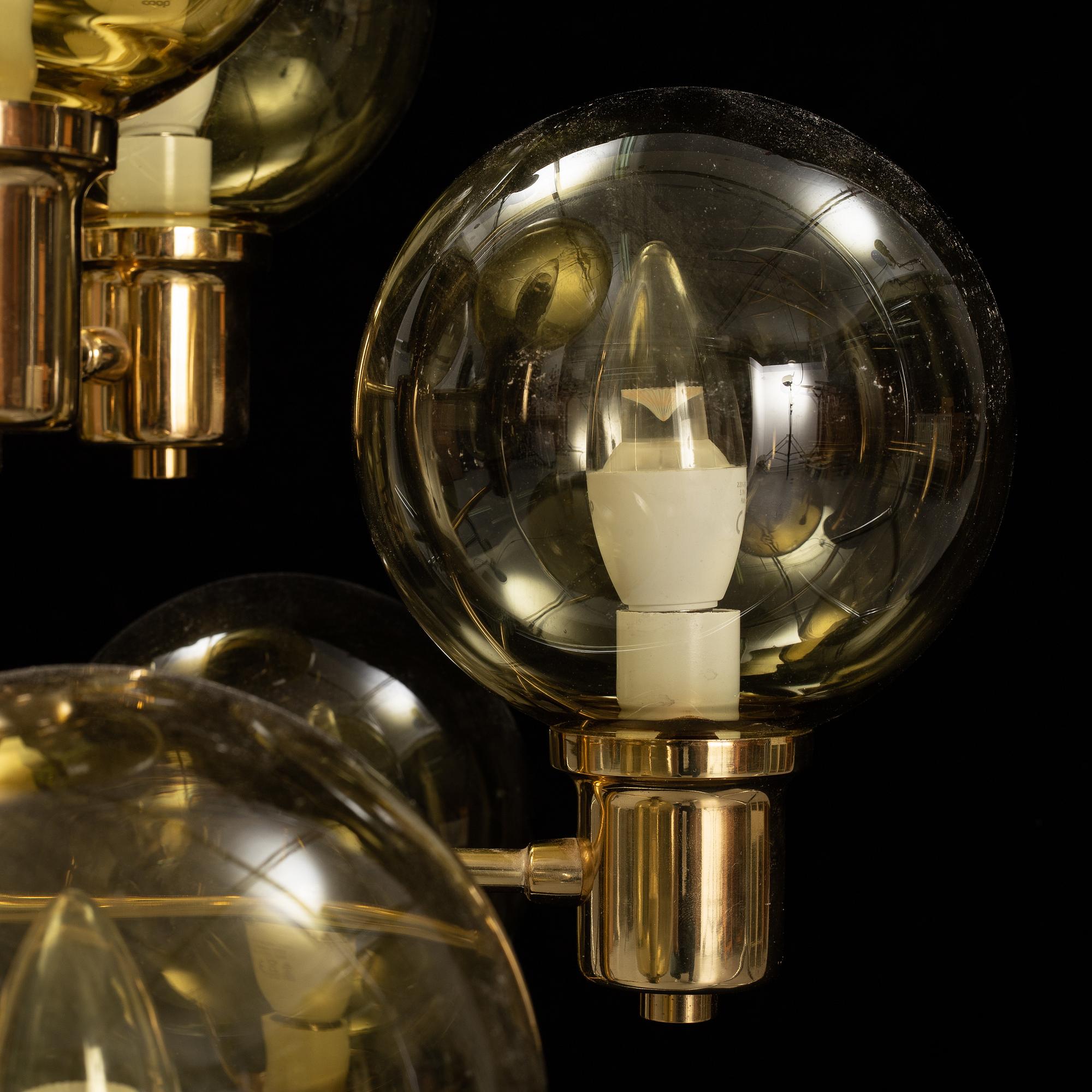 A 1960's brass and glass ceiling light.