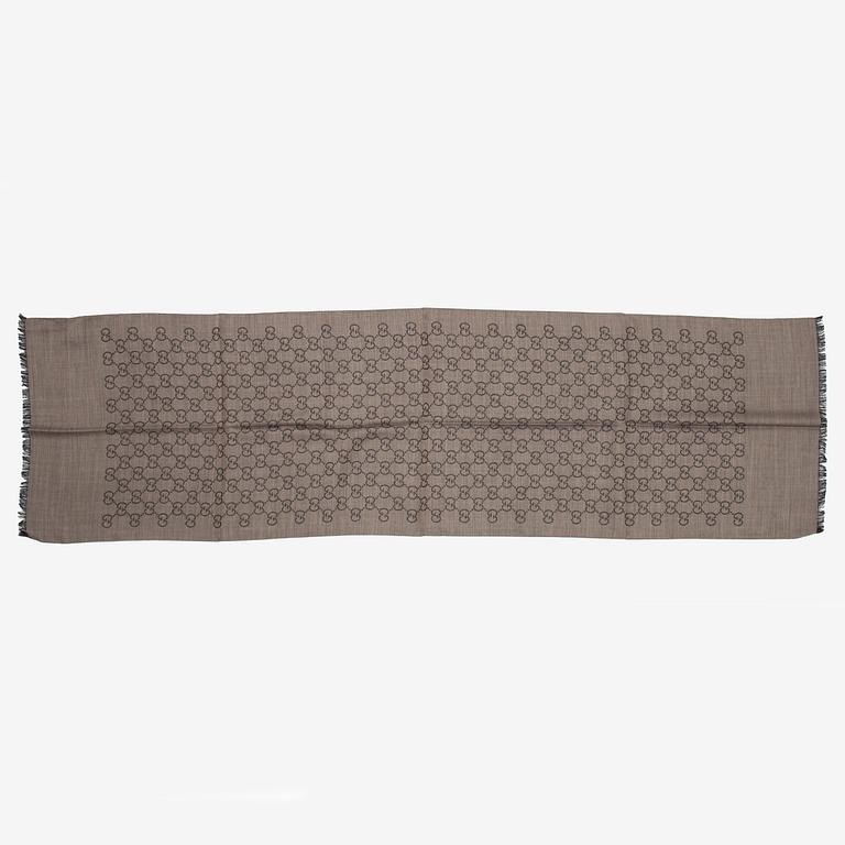 Gucci, a wool and silk mix 'GG' jaquard shawl.