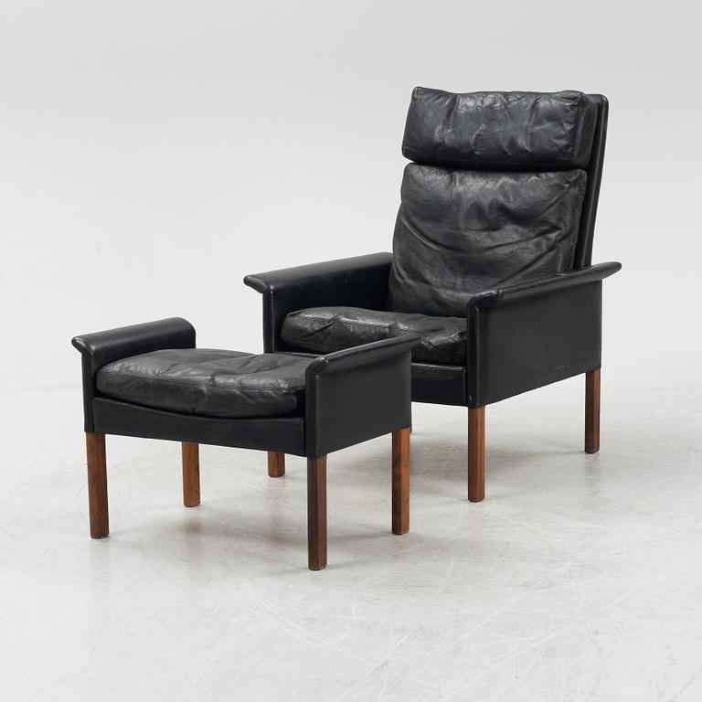 Hans Olsen,  a black leather easy chair with a stool, CS Möbler, Denmark, 1950's-60's.