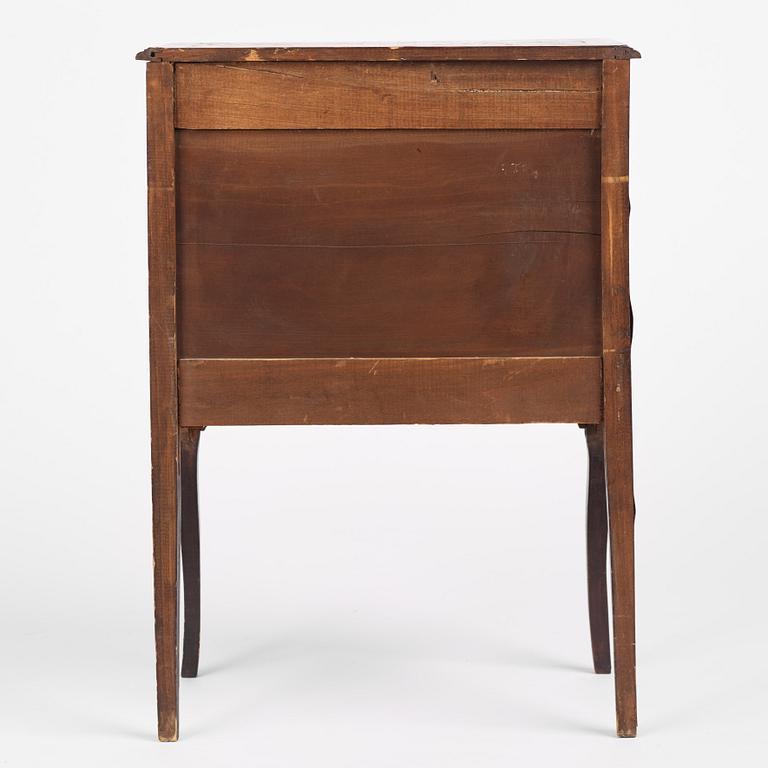A Louis XVI-style parquetry commode, circa 1900.