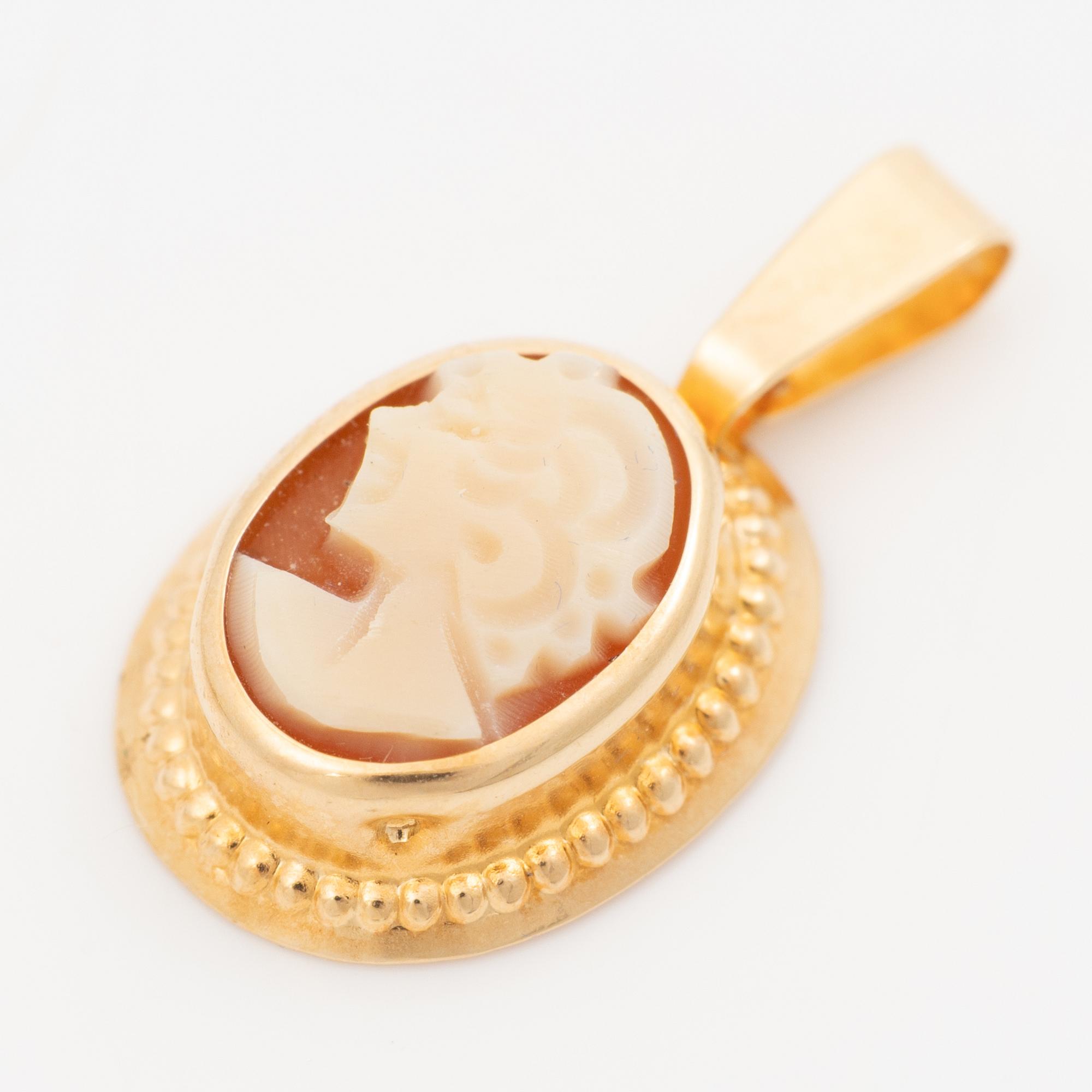 Brooch/pendant, 14K white gold and pendant in 18K gold, both with shell cameos, one with a small diamond.