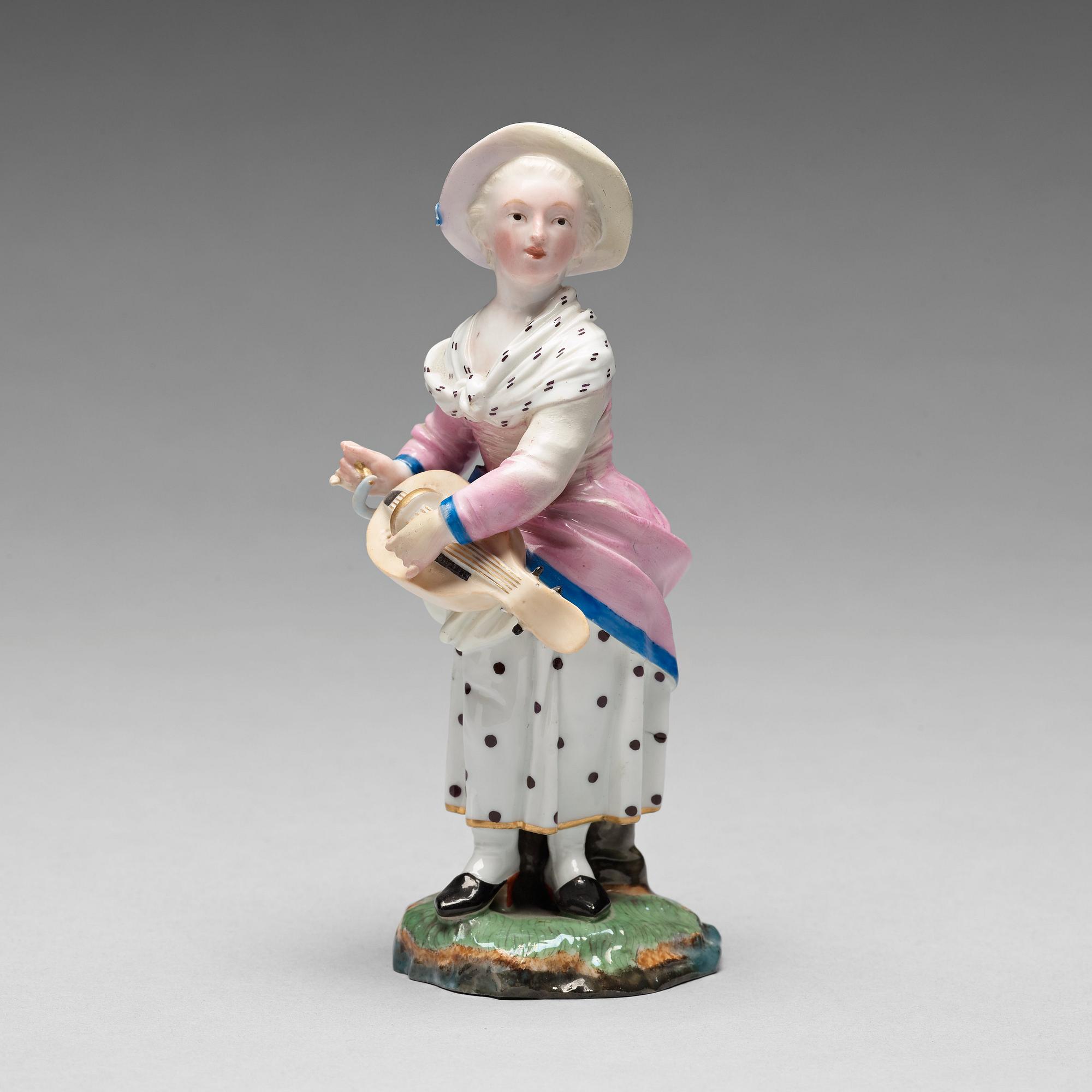 FIGURIN, porslin. Höchstliknande märke, omkring 1900.