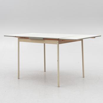 A table and four chairs, mid-20th Century.