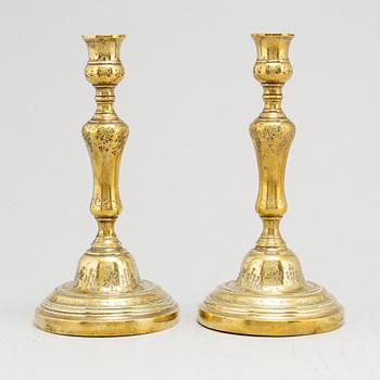 A pair of 18th century Louis XV bronze candlesticks.