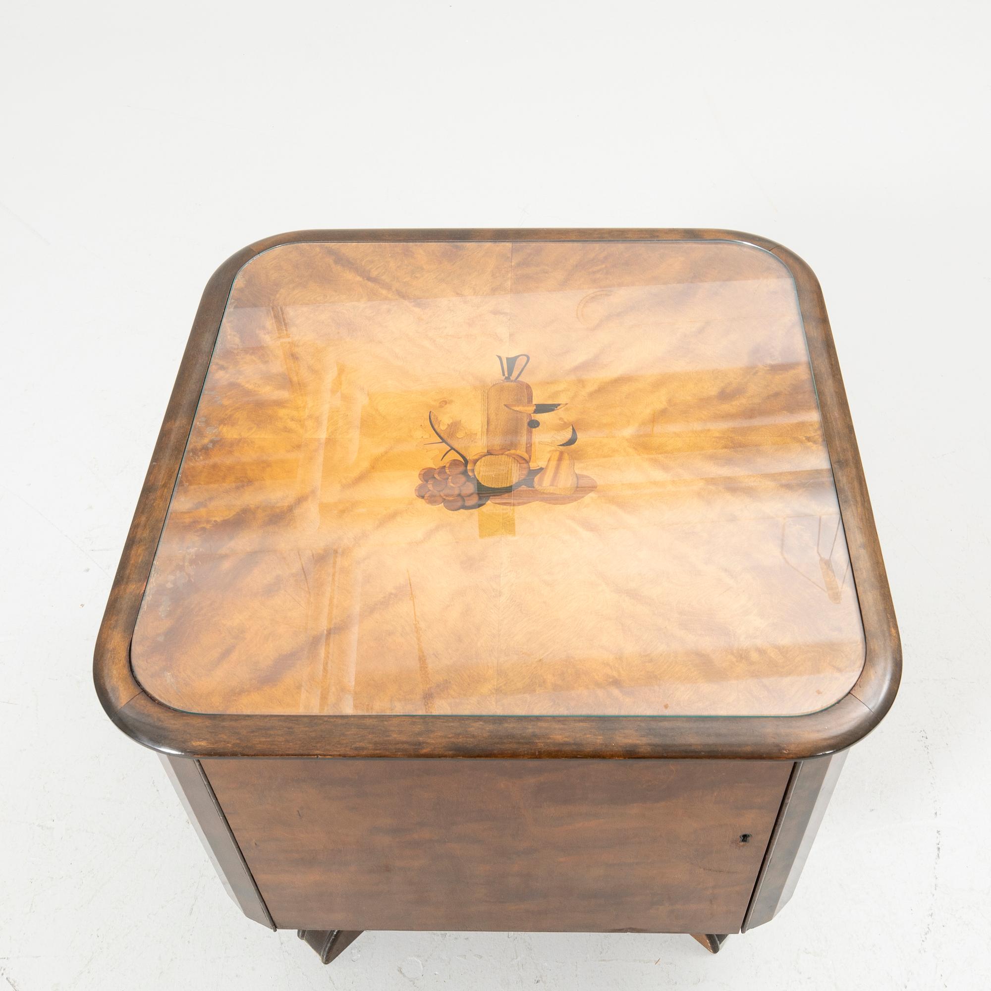 Rotating table with fitted bar, 1930s/40s.