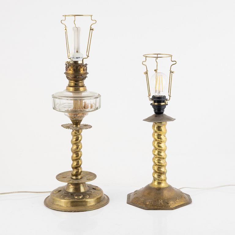 Two Baroque style brass table lamps from around the year 1900.