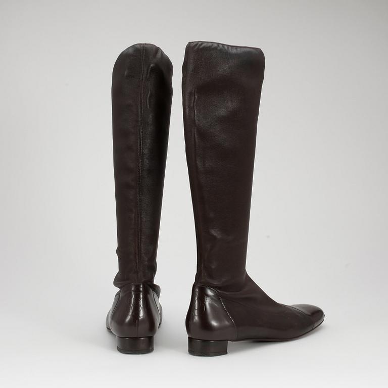 CHANEL a pair of brown leather boots.