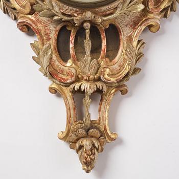 A Swedish Rococo giltwood cartel clock, Stockholm, later part of the 18th century.