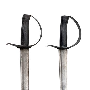 Two 19th century naval cutlasses.