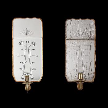 A pair of Swedish 18th century one-light girandole mirrors by E. Göbel.