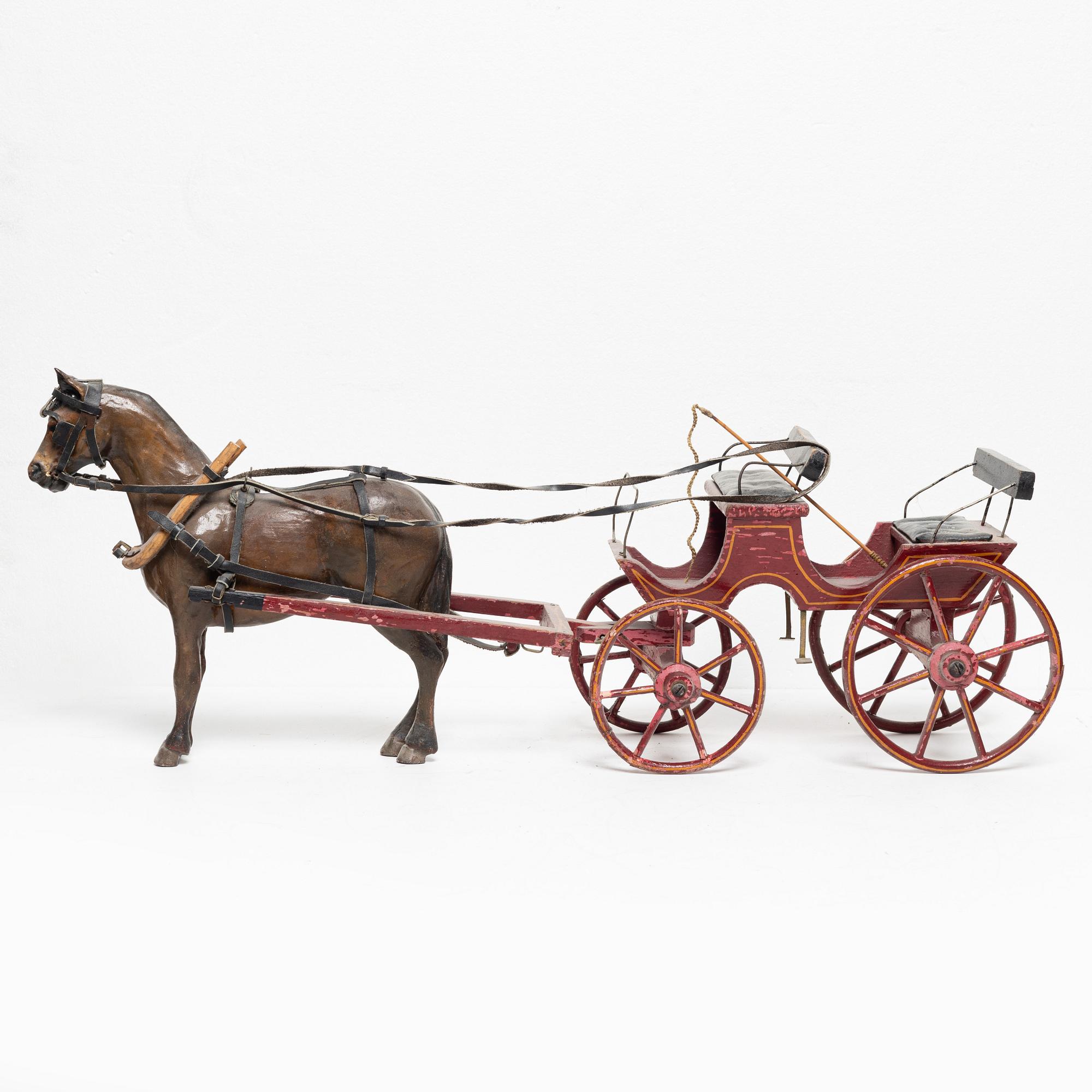 Horse-drawn carriage, early 20th century.