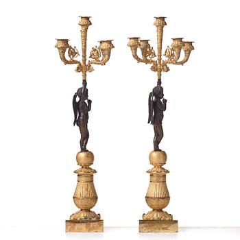 A pair of French Empire early 19th century five-light candlesticks.