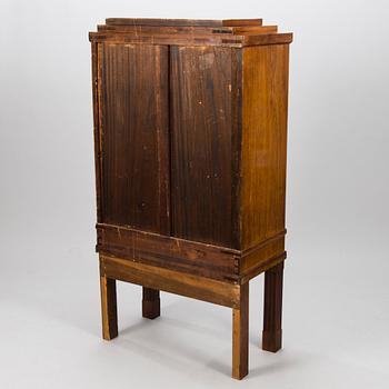 An Art Déco mahogany cabinet.