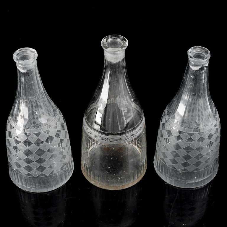 A set of three (2+1) bottles, 19th Century.