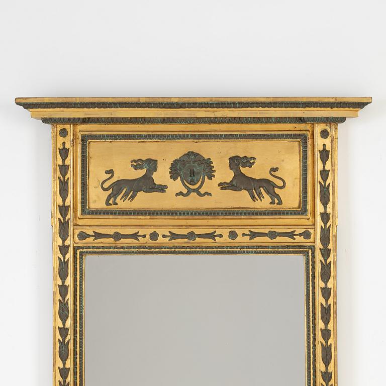 A Empire mirror from the first half of the 19th century.