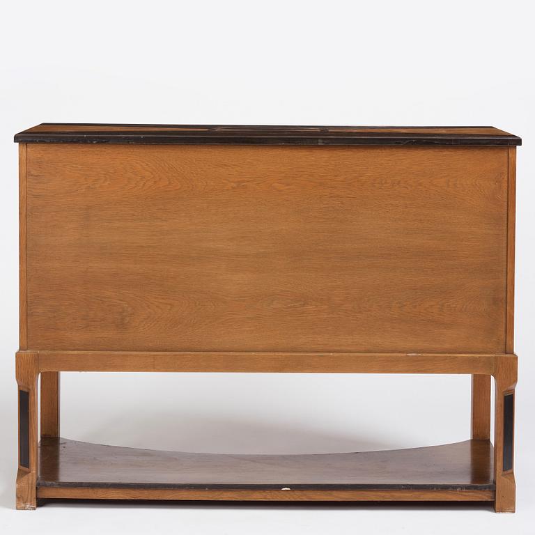 Carl Bergsten, an oak veneered sideboard/ chest of drawers, Nordiska Kompaniet Sweden 1923. Part of a set exhibited in Gothenburg 1923.